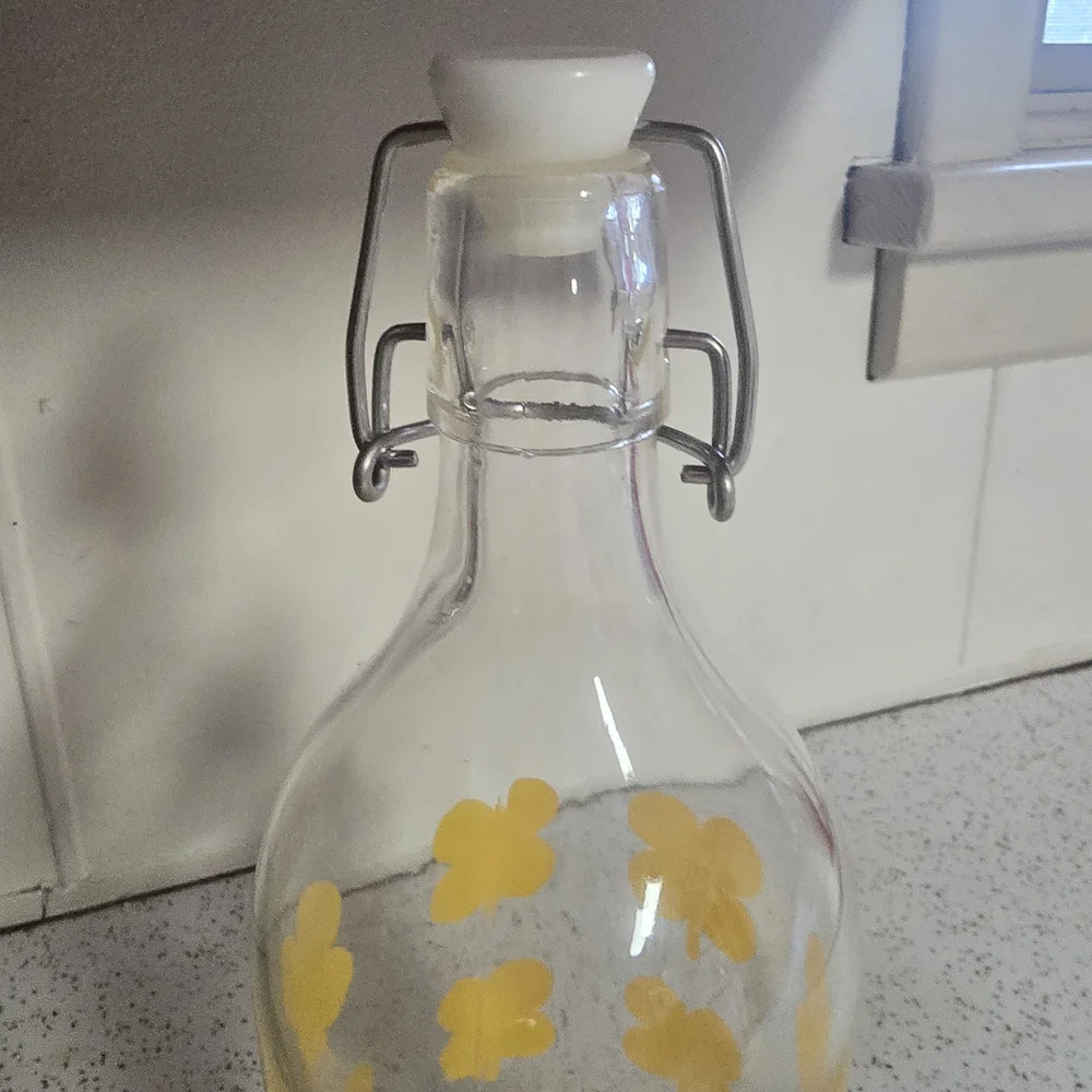 IKEA Clear Glass Jar with Yellow Floral Accents